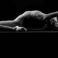 Buy canvas prints of young woman nude art photography naked on black an by Alessandro Della Torre