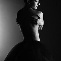 Buy canvas prints of A classic ballerina ballet dancer woman in a classical tutu dress posing on black by Alessandro Della Torre
