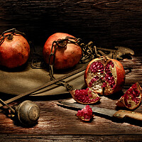 Buy canvas prints of Pomegranates on a wooden table by Alessandro Della Torre