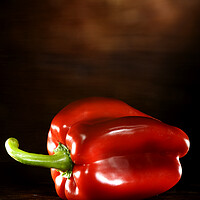 Buy canvas prints of Red Pepper on a wood table by Alessandro Della Torre