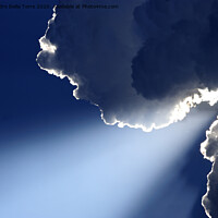 Buy canvas prints of Sunlight rays coming out from clouds by Alessandro Della Torre