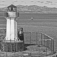 Buy canvas prints of Ardrossan harbour lighthouse and mountains on Arra by Allan Durward Photography