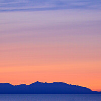 Buy canvas prints of Colourful sky at sunset over Arran by Allan Durward Photography