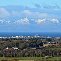 Buy canvas prints of Troon and snow covered Isle of Arran mountains by Allan Durward Photography