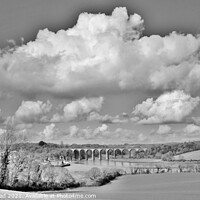 Buy canvas prints of Cloudy Skies Over St Germans. by Neil Mottershead