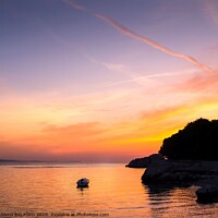 Buy canvas prints of A sunset over a body of water by BRANKO BALAŠKO