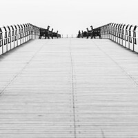 Buy canvas prints of Along the Pier by Jaxx Lawson