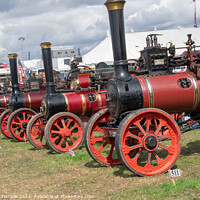 Buy canvas prints of A line up of red engines by Hannah Temple