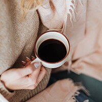 Buy canvas prints of A close up of a person holding a cup of coffee by Omar Al-Ashi