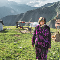 Buy canvas prints of Old woman outside her yurt in the mountains of Kyrgyztan by Frank Bach