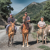 Buy canvas prints of Three men riding horses and a donkey in Kyrgyzstan by Frank Bach