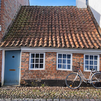 Buy canvas prints of Cobbled streets in the old medieval city Ribe, Denmark by Frank Bach