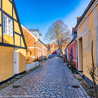 Buy canvas prints of Cobbled streets in the old medieval city Ribe, Denmark by Frank Bach