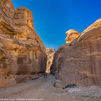 Buy canvas prints of Entrance to Petra through the gorge Siqh by Frank Bach