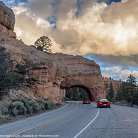 Buy canvas prints of Red Arch road tunnel on the way to Bryce Canyon National Park, Utah by Frank Bach