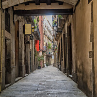 Buy canvas prints of Small street in Barcelona Gothic quarter by Frank Bach