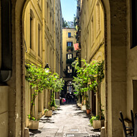 Buy canvas prints of Small street in Barcelona Gothic quarter by Frank Bach