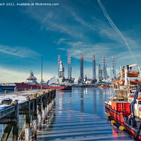 Buy canvas prints of Wind power rigs in Esbjerg harbor. Denmark by Frank Bach