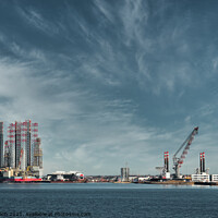 Buy canvas prints of Oil and Wind power rigs in Esbjerg harbor. Denmark by Frank Bach