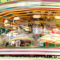 Buy canvas prints of Carousel spinning  by Richard Ashbee