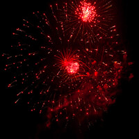 Buy canvas prints of Red fireworks explode by Richard Ashbee