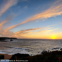 Buy canvas prints of Thurlestone rock, sunset with clouds swirling in t by Richard Fearon