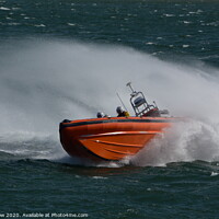 Buy canvas prints of Beaumaris lifeboat with big spray by Tim Snow