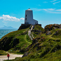 Buy canvas prints of Walking towards Twr Mawr lighthouse on Llanddwyn Island by Tim Snow
