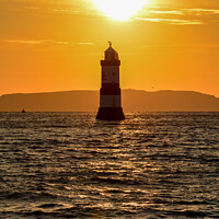 Buy canvas prints of Trwyn Du lighthouse on Anglesey at Sunrise by Tim Snow