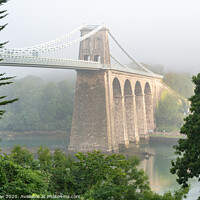 Buy canvas prints of Foggy Menai Suspension bridge crossing over to Anglesey by Tim Snow