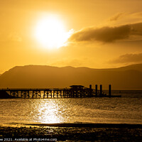 Buy canvas prints of Sunrise over Beaumaris Pier on Anglesey by Tim Snow