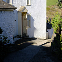 Buy canvas prints of A house on a narrow street in Port Isaac. by Peter Barber