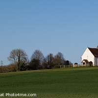 Buy canvas prints of Panaramic image of St Huberts Church in Idsworth by Peter Barber