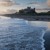 Buy canvas prints of Bamburgh Castle at Sunrise by Peter Barber