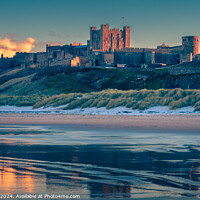 Buy canvas prints of Bamburgh Castle Golden Hour by Dick Lloyd