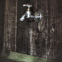 Buy canvas prints of Old unused water faucet on a wooden wall by Ingo Menhard
