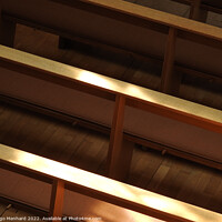 Buy canvas prints of High angle shot of church pews with a sunlight by Ingo Menhard
