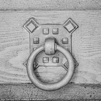 Buy canvas prints of A closeup shot of an old metal doorknob on a wooden door by Ingo Menhard