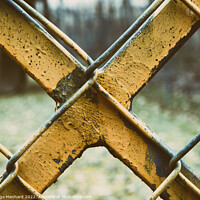 Buy canvas prints of Old and weathered yellow-painted metal fence by Ingo Menhard