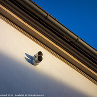 Buy canvas prints of Low angle shot of a surveillance camera on a building by Ingo Menhard