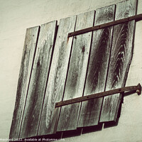Buy canvas prints of An aged wall with wooden planks by Ingo Menhard