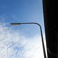 Buy canvas prints of A low angle shot of a street light on a cloudy sky background by Ingo Menhard