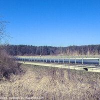 Buy canvas prints of Beautiful view of an empty highway road with road barriers by Ingo Menhard