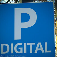 Buy canvas prints of Closeup shot of a blue and white parking sign on a blurred background by Ingo Menhard