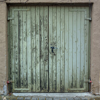 Buy canvas prints of The old wooden green door with a rusty lock and handle by Ingo Menhard