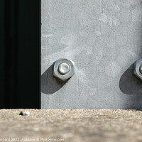 Buy canvas prints of Two big screws in a steel plank by Ingo Menhard