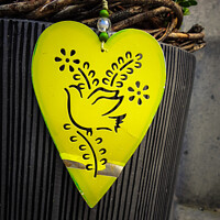 Buy canvas prints of The close-up shot of a yellow heart-shaped decoration by Ingo Menhard