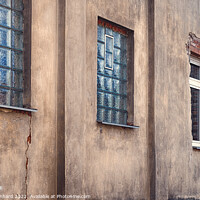 Buy canvas prints of Old weathered wall facade with windows by Ingo Menhard