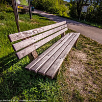 Buy canvas prints of High angle shot of a bench near a street by Ingo Menhard
