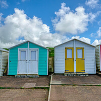Buy canvas prints of Vibrant Beach Huts Overlooking Crooklets Beach by Tracey Turner